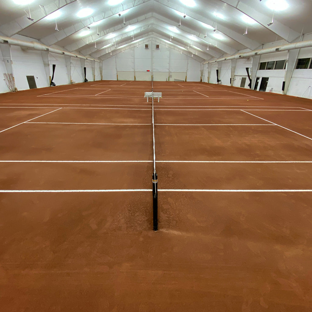 Indoor caliclay clay tennis court system